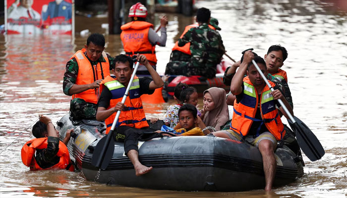 Rescuers evacuate people using a rubber boat from a flooded residential area following heavy rains in Jakarta, Indonesia, March 4, 2025.—Reuters