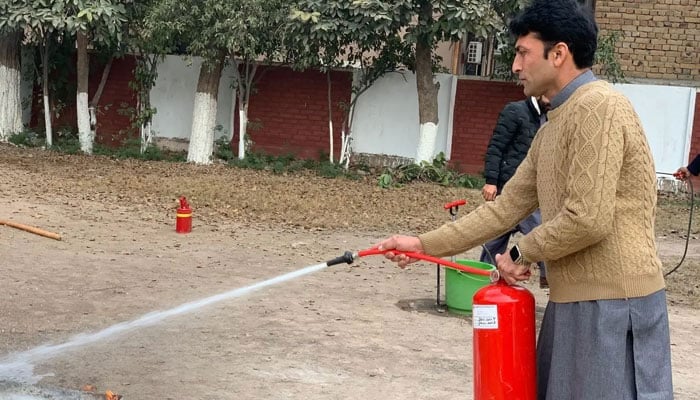 A participant of a civil defence programme is seen taking part in the training. — Govt civil defence website/File