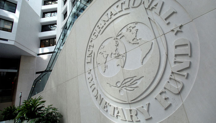The International Monetary Fund (IMF) logo is displayed outside its headquarters in Washington, DC, on October 8, 2022. — AFP