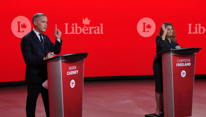 Mark Carney (right) and Chrystia Freeland, at a February debate. — AFP/File