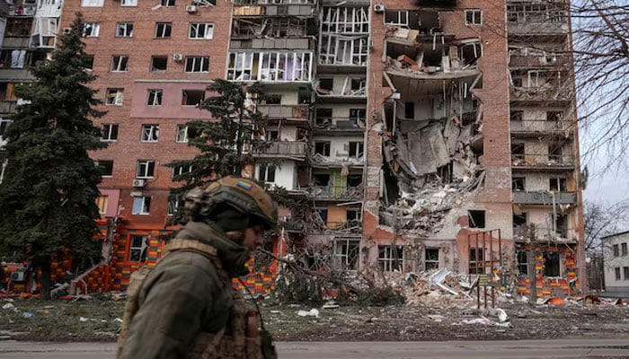 A Ukrainian serviceman passes by a residential building damaged by Russian military strikes, amid Russias attack on Ukraine, in the frontline town of Pokrovsk in Donetsk region, Ukraine March 6, 2025. — Reuters