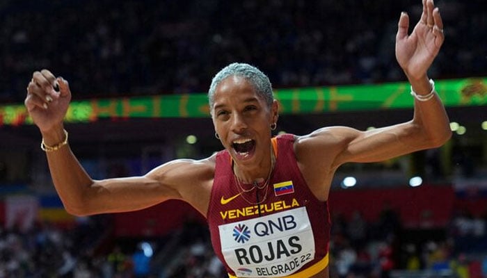 Venezuelas Yulimar Rojas celebrates winning gold and setting a new world record in the womens triple jump final of World Athletics Indoor Championships on March 20, 2022. — Reuters