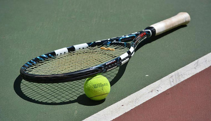 Representational image of racket and tennis ball. —AFP/File