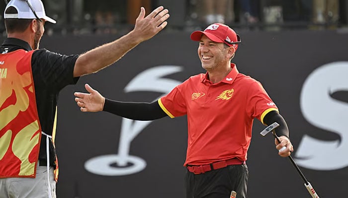 Fireballs GC player Sergio Garcia of Spain (right) celebrates his win with his caddy on day three of the LIV Golf tournament at the Fanling Golf Club in Hong Kong on March 9, 2024.— AFP