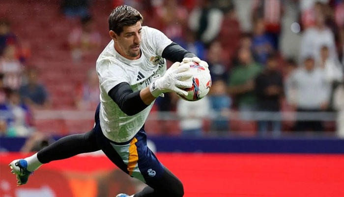 Real Madrids Belgian goalkeeper #01 Thibaut Courtois warms up before the Spanish league football match between Club Atletico de Madrid and Real Madrid CF at the Metropolitano stadium in Madrid on September 29, 2024. —AFP