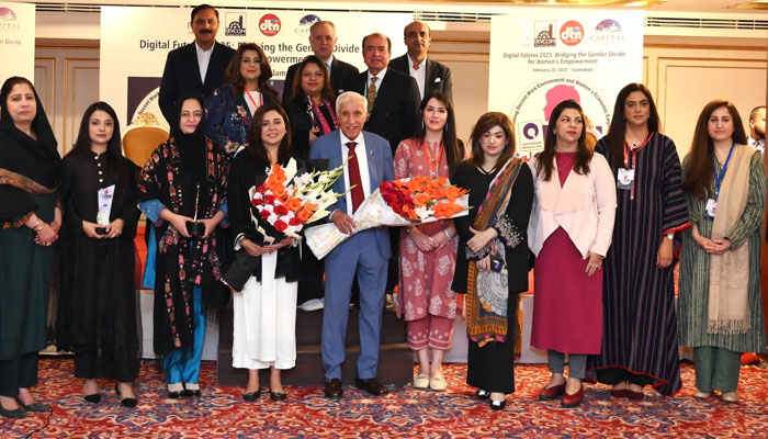 Participants pose for a group photo at an award ceremony to mark International Women’s Day 2025 on March 6, 2025. — Facebook@DevcomPakistan