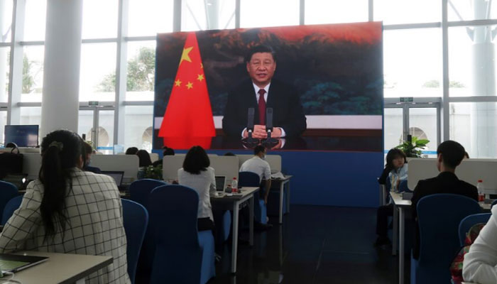 Chinese President Xi Jinping is seen on a giant screen at a media center as he delivers via video link a keynote speech at the opening ceremony of the Boao Forum for Asia in Boao, Hainan province, China, on April 20, 2021. — Reuters