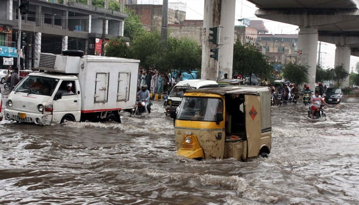 This representational image shows passengers and vehicles facing difficulties in transportation due to the poor sewage system on August 1, 2024. — PPI