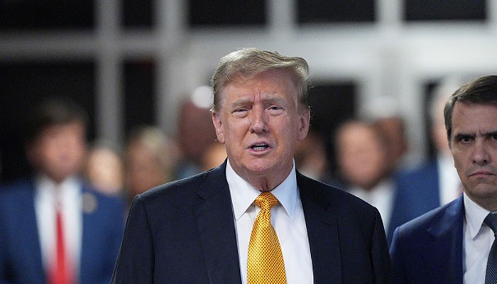 US President Donald Trump (centre) attends his trial for allegedly covering up hush money payments linked to extramarital affairs, at Manhattan Criminal Court in New York City, on May 21, 2024. — AFP