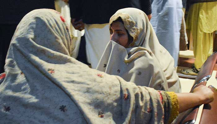Passengers who were rescued from a train after it was attacked by militants, sit at the Railway Station in Quetta,Balochistan, March 12, 2025.—Reuters