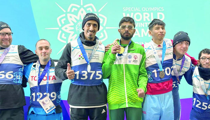 Pakistans Afaq Khan posing for photo as he has won gold medal for the country in hundred meter snowshoeing race at the Special Olympics World Winter Games in Turin, Italy. —Radio Pakistan/File