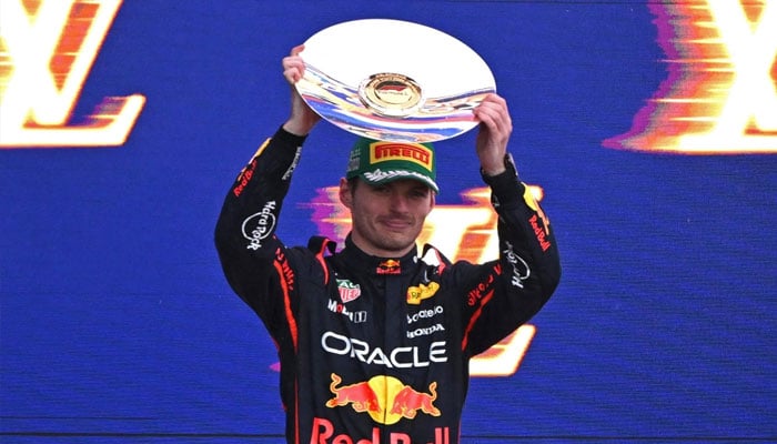 Second-placed Red Bull Racings Dutch driver Max Verstappen celebrates on the podium with his trophy at the end of the Australian Formula One Grand Prix at Albert Park Circuit in Melbourne on March 16, 2025. — AFP