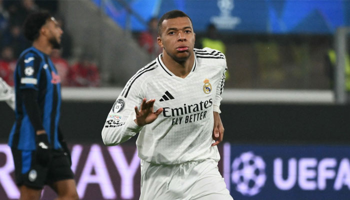 Real Madrid’s French forward Kylian Mbappe celebrates his team’s first goal during the UEFA Champions League football match against Atalanta at the Gewiss Stadium in Bergamo, on December 10, 2024. —AFP