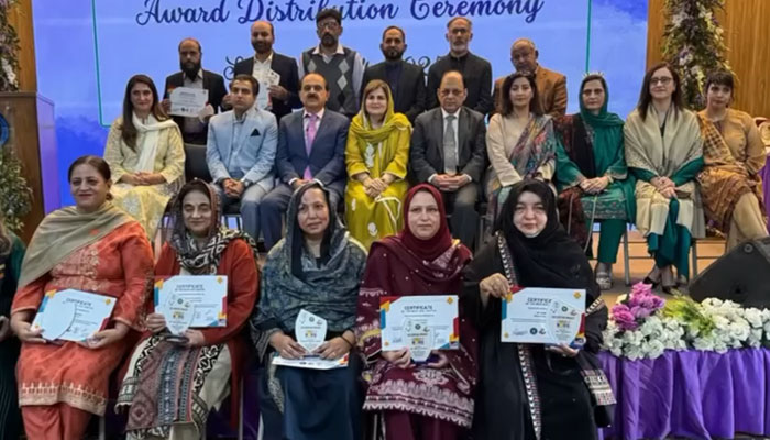 Education Secretary Mohyuddin Wani (3rd left in 2nd row) in a group photo at a special award ceremony at the Islamabad Model School for Girls, F-7/2, on March 17, 2025. — Screengrab via Facebook@mofept