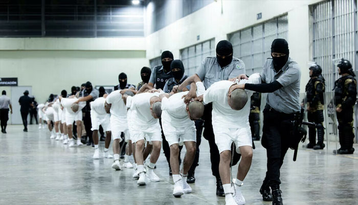 Salvadoran police officers escort alleged members of the Venezuelan gang Tren de Aragua recently deported by the US government to be imprisoned in the Terrorism Confinement Center (CECOT) prison. —Reuters/File