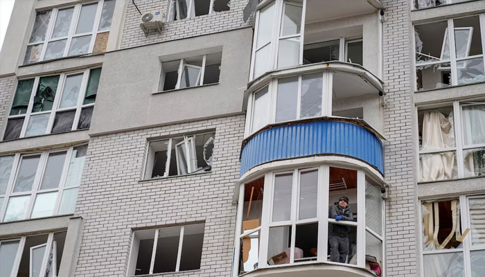 A resident stands on the balcony of his flat in an apartment building hit by a Russian drone strike, amid Russias attack on Ukraine, in Chernihiv, Ukraine March 15, 2025.—Reuters