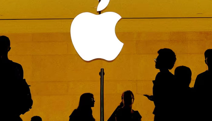 Customers walk past an Apple logo inside of an Apple store at Grand Central Station in New York, US, August 1, 2018. —Reuters