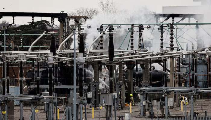 Smoke rises from the area of an electrical substation, after a fire there wiped out the power at Heathrow International Airport, in Hayes, London, Britain, March 21, 2025. — Reuters
