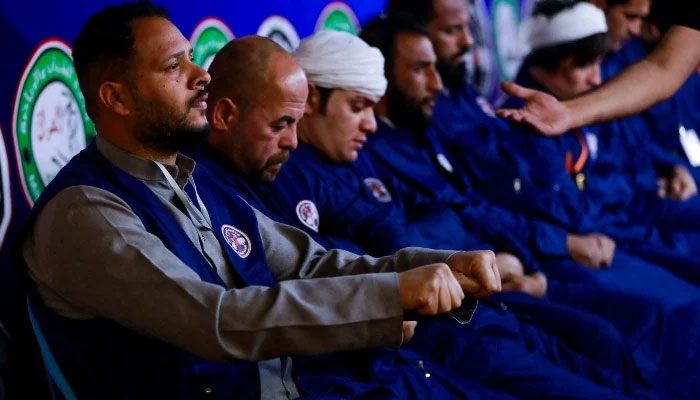 Participants play Mheibes, a decades-old fiery game in which rival teams must find a ring hidden by their opponents, at Al-Shaab Stadium in Baghdad early on March 19, 2025. — AFP