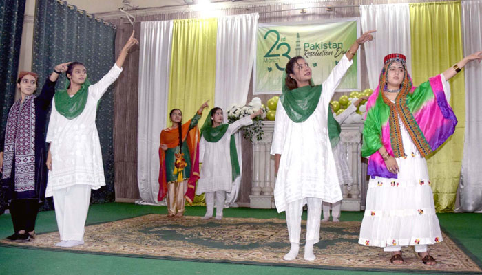 Students are performing tableaus on stage during the celebration ceremony of Pakistan Resolution Day held at Frontier College premises in Peshawar on March 23, 2025. — PPI