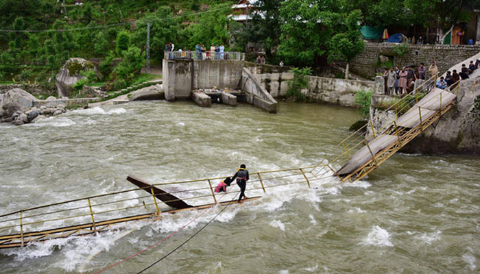 Pakistani rescuers search for missing university students after a bridge collapsed in Kundal Shahi, Neelum district on May 13, 2018. —AFP