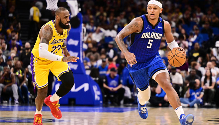 Paolo Banchero of the Orlando Magic drives past LeBron James in the Magics NBA victory over the Los Angeles Lakers. —AFP/File