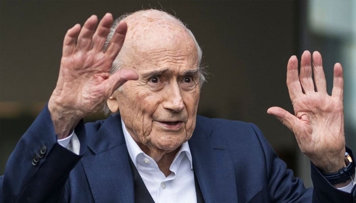 Former FIFA president Sepp Blatter reatcs while leaving the court. —AFP/File
