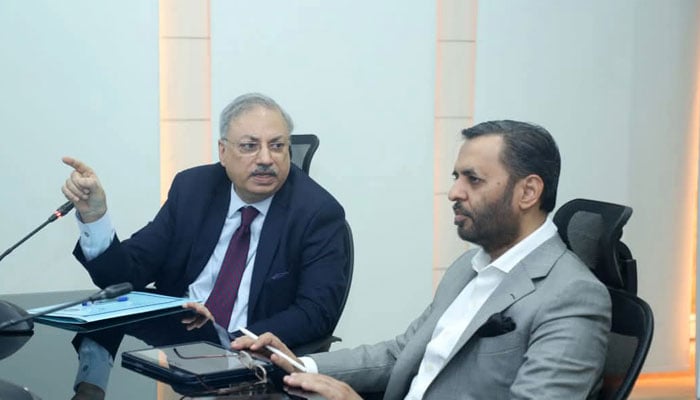 PMDC President Rizwan Taj (left) gives a detailed briefing to the National Health Services (NHS) minister Mustafa Kamal during his visit to the main offices of the PMDC on March 28, 2025. — Facebook@KamalMQM