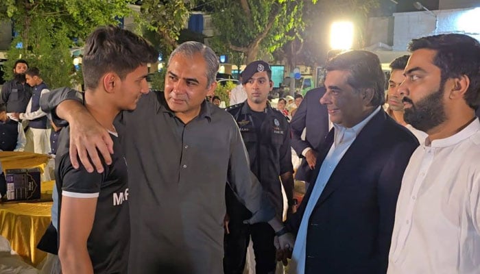 Federal Interior Minister Mohsin Naqvi interacts with children during his visit to the model children’s home in Samanabad, Lahore on March 28, 2025. — Facebook@Ministry of Interior GoP