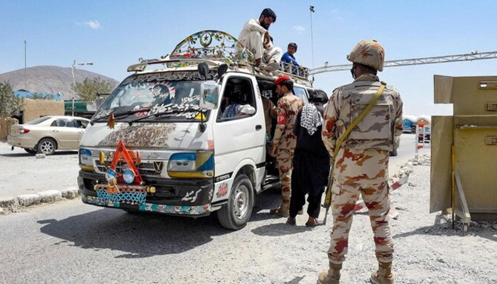 Pakistan’s paramilitary rangers inspect a passenger van at a checkpoint on Aug. 27, 2024. — AFP