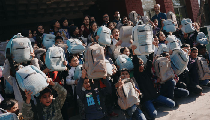 SOS children villages children showing bags donated by Emirates International Airlines. — Emirates website/File