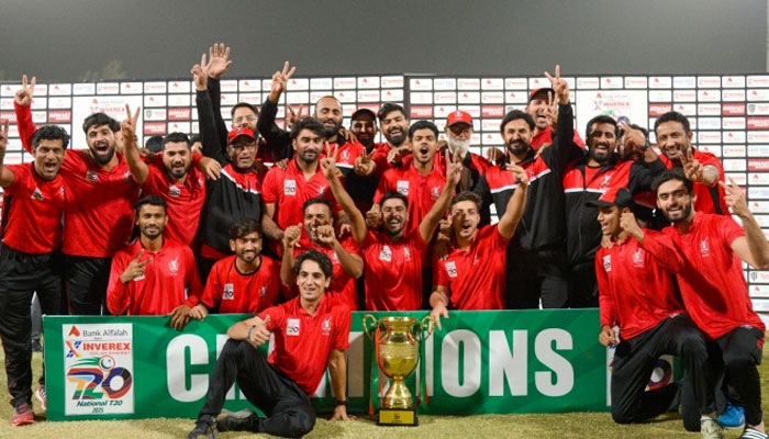 Lahore blues posing for picture with trophy. —PCB/File