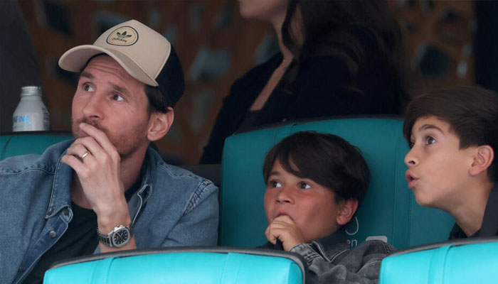 Lionel Messi and his family watch the semi-final match between Novak Djokovic and Grigor Dimitrov at the Miami Open. —AFP/File