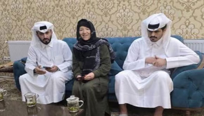 American citizen Faye Hall (centre). —X@realZealmayMK/File