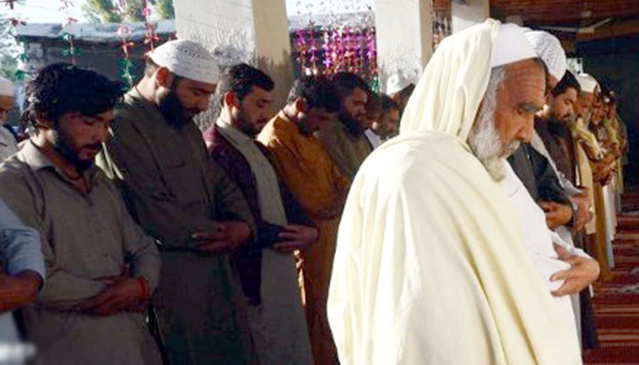Afghan migrants offering Eid prayer at Khorasan Camp on Charsadda Road on March 30, 2025. — INP