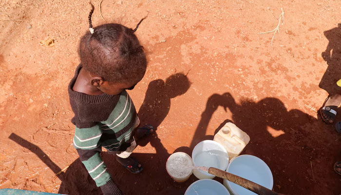 A child waits for her turn to get water in Khartoum Bahri, Hattab area, Omdurman, Sudan, November 9, 2024. —Reuters