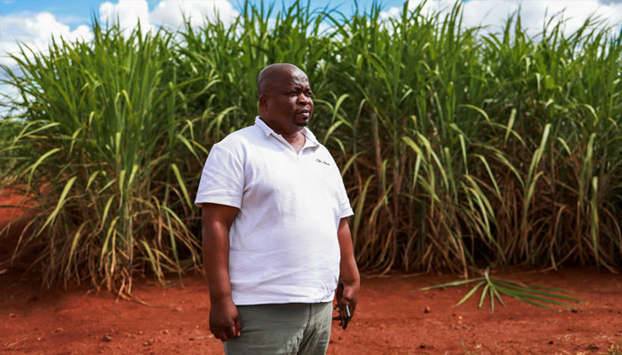 Spokesperson for Matsamo CPA Bernard Shabangu poses for a photograph near their offices in the Kaalrug area south-east of Malelane on March 12, 2025. The Matsamo CPA now owns over 14 000 hectares which they farm in two joint ventures, as one of the rare models of successful land reform in South Africa. — AFP
