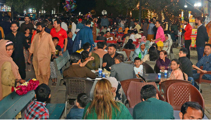 Families enjoying food at Sadar Food Street during Eid ul Fitr, in Rawalpindi on April 2, 2025. — Online