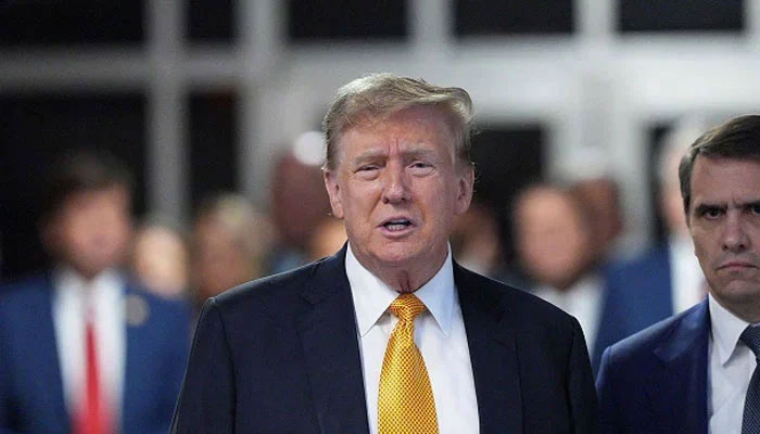 US President Donald Trump (centre) attends his trial for allegedly covering up hush money payments linked to extramarital affairs, at Manhattan Criminal Court in New York City, on May 21, 2024. — AFP