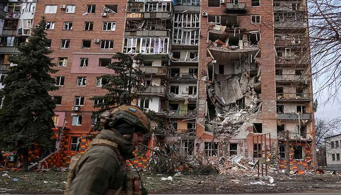 A Ukrainian serviceman passes by a residential building damaged by Russian military strikes, amid Russias attack on Ukraine, in the frontline town of Pokrovsk in Donetsk region, Ukraine March 6, 2025. — Reuters