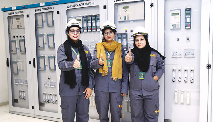 Female electricians posing for photo. —KE/File