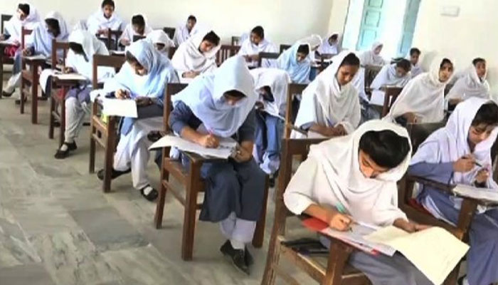 Students taking exam in examination hall. —TheNews/File