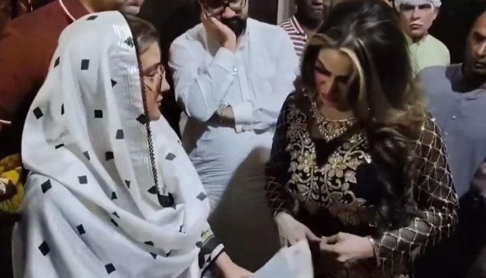 Punjab Information and Culture Minister Azma Bokhari (left) speaks with theatre actress during surprise raids on theatre in Lahore on April 3, 2025. — Screngrab via Facebook@AzmaBokhariPMLN
