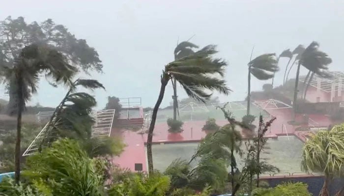 This video grab shows tropical storm force winds blowing across Tumon Bay, Guam on May 24, 2023. —  AFP