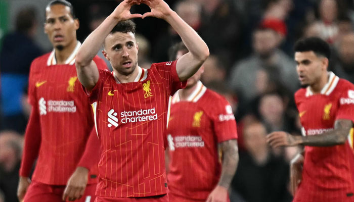 Liverpool players celebrating. — AFP/File