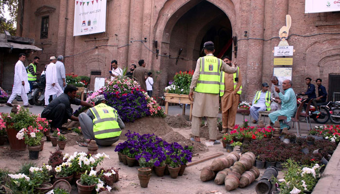 Visitors take keen interest in flowers during the Mela Baharan organized by Walled City of Lahore Authority (WCLA) and Punjab Government, at Delhi Gate in Lahore on April 4, 2025. — PPI