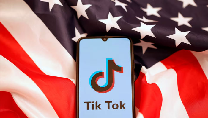 Tik Tok logo is displayed on the smartphone while standing on the U.S. flag in this illustration picture taken, November 8, 2019. — Reuters