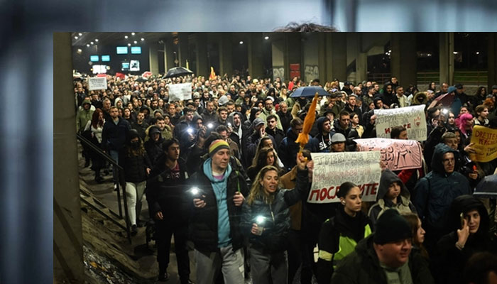 Protestors march through the streets of Skopje during a protest for justice for the victims who lost their lives in the Kocani fire accident. — AFP