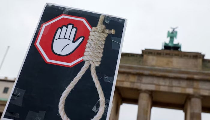 A placard is seen during a protest against the Islamic regime of Iran following the death of Mahsa Amini, in Berlin, Germany, December 10, 2022. — Reuters