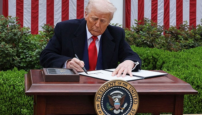 US  President Donald Trump signs an executive order on tariffs, in the Rose Garden at the White House in Washington, DC, US, April 2, 2025. — Reuters